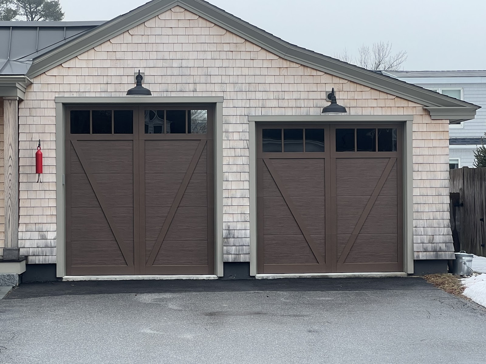 New carriage-style garage doors on a coastal home